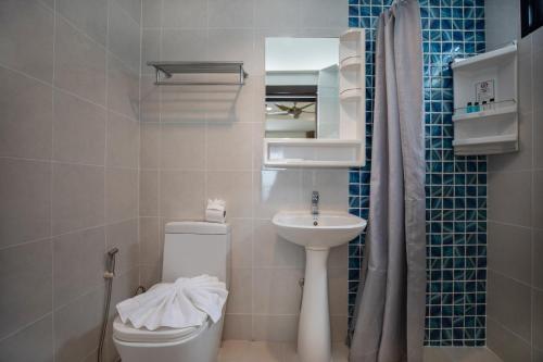 a small bathroom with a toilet and a sink at Baan Chom View Kamala - SHA Plus in Kamala Beach
