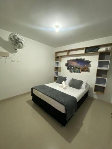 a bedroom with a large bed in a room at ApartaSol san Jerónimo in San Jerónimo
