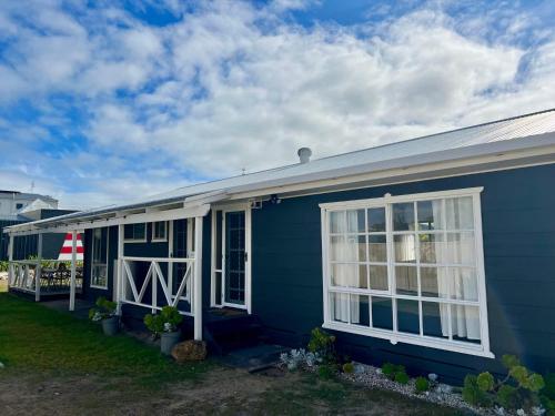 a blue house with white doors and windows at ROBE TWO FIVE - Pet friendly outside WiFi in Robe