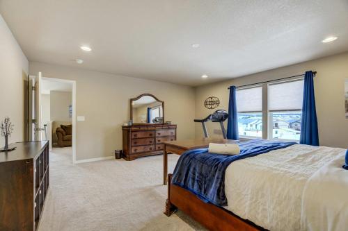 a bedroom with a bed and a dresser and a mirror at Clear Estate Spacious Retreat with BBQ & Views in Pikeview