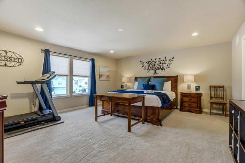 a bedroom with a bed and a flat screen tv at Clear View Scenic Retreat w Work-Friendly Spaces in Pikeview