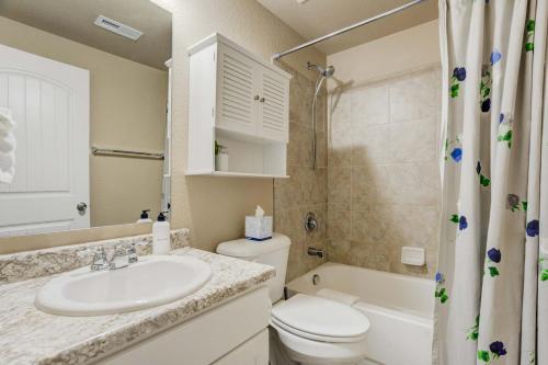 a bathroom with a sink and a toilet and a shower at Clear Creek Cozy Getaway with Private Patio in Pikeview