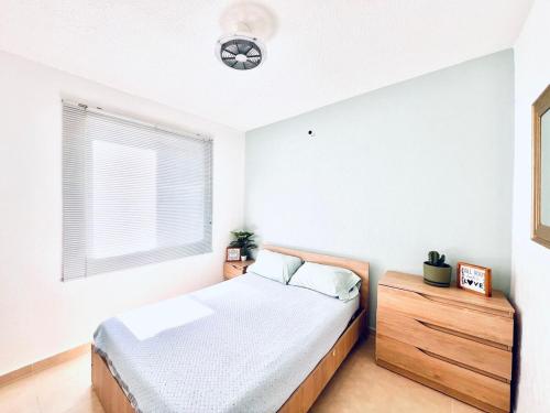 Una cama o camas en una habitación de Temixco Mágico con alberca