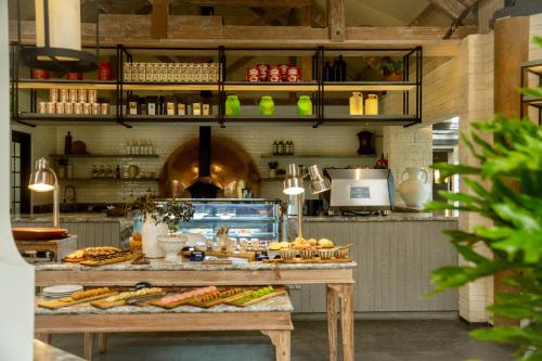 a kitchen with a table with food on it at Novus Giri Resort & Spa in Puncak
