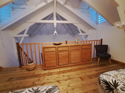 a room with a wooden cabinet in a attic at Villa SAINT BARTHELEMY in Saint-François