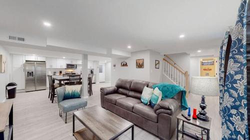 a living room with a couch and a table at Modern & Updated Unit in Prime Location in Denver
