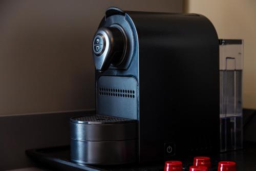 a black router sitting on top of a table at MH SUITES Plebiscito in Naples