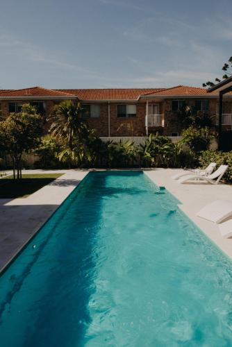 a swimming pool in front of a house at Park St in Evans Head