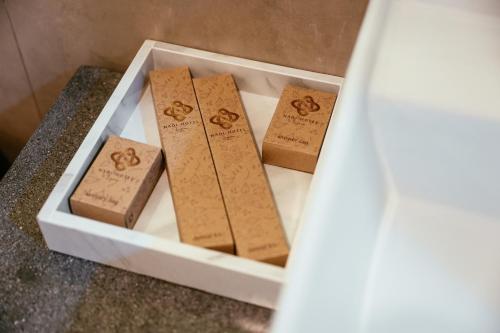 a white tray with four rolls of toilet paper at Nadi Hotel Legian in Legian
