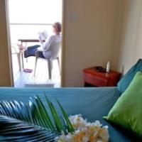 a woman sitting in a chair in a room at Crab Claw Island in Bynoe Harbour
