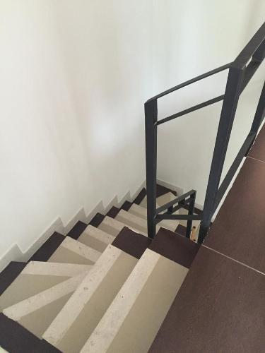 a set of stairs with a glass railing on it at Conjunto Buganviles - in Girardot