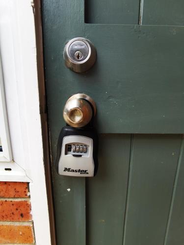 a door with a meter on a green door at Regent Residential House in Whangarei