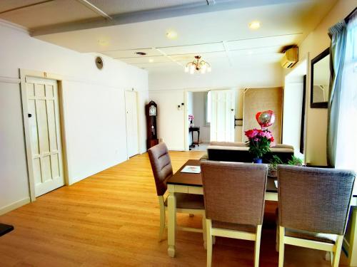 a dining room with a table and chairs at Regent Residential House in Whangarei