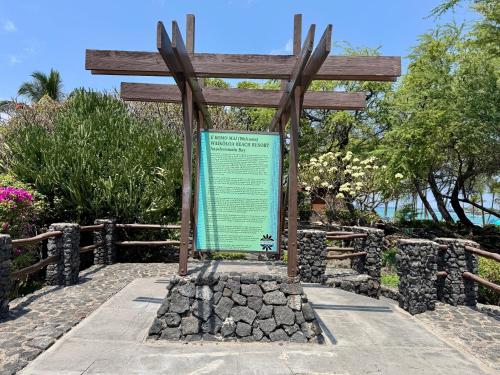a large wooden cross in front of a fence at Shores at Waikoloa 132 Hale Kai in Waikoloa