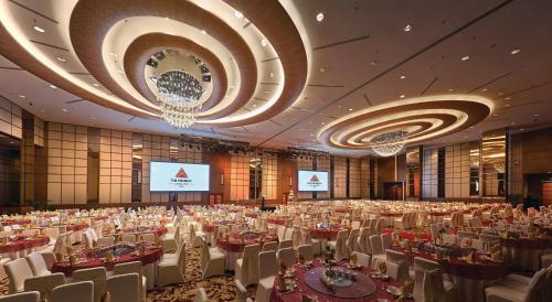 a large banquet hall with tables and chairs at St Giles Wembley Penang in George Town