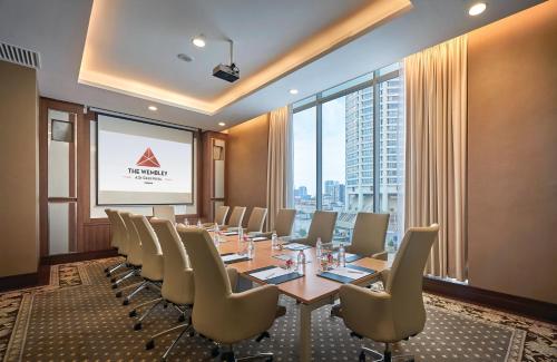a conference room with a long table and chairs at St Giles Wembley Penang in George Town