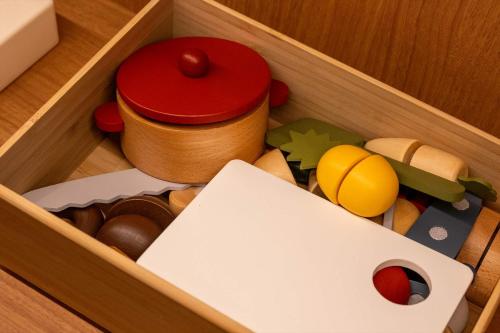 a wooden box filled with different types of toys at Dantokan Kikunoya in Otsu