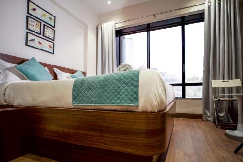 Cama o camas de una habitación en Sunbright Hotel
