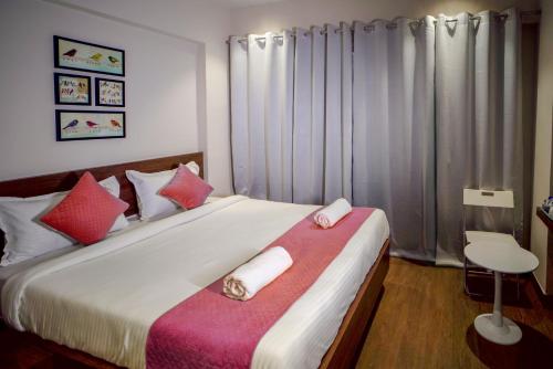 Cama o camas de una habitación en Sunbright Hotel