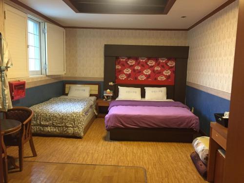 Postel nebo postele na pokoji v ubytování Prince Hotel