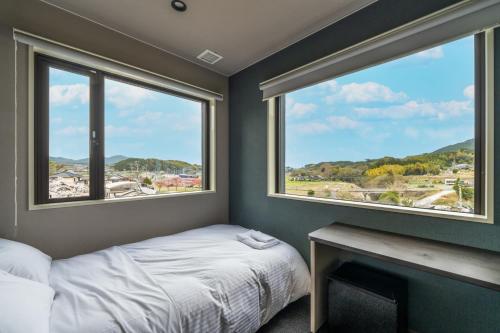 Postel nebo postele na pokoji v ubytování HOTEL Tsmart
