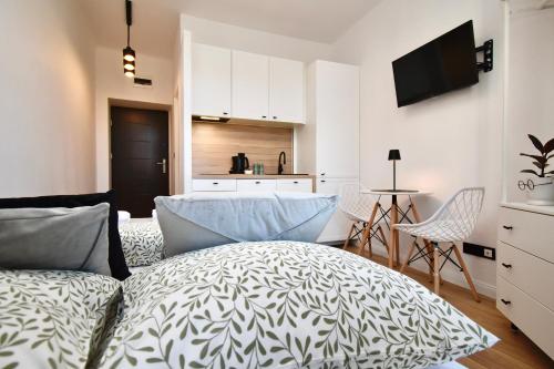 Ένα ή περισσότερα κρεβάτια σε δωμάτιο στο Rental Apartments Dekerta