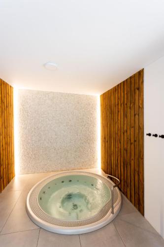 a bath tub in the corner of a bathroom at Four Winds in Krynica Morska
