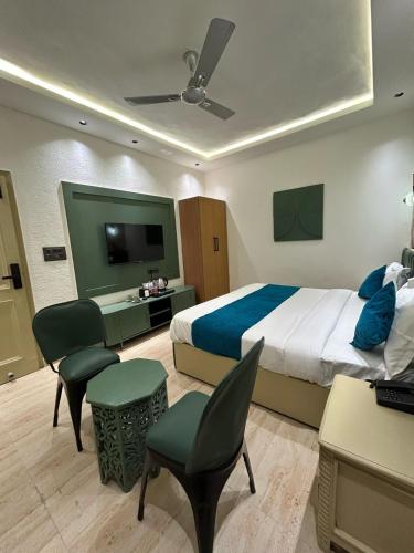 Postel nebo postele na pokoji v ubytování Divine Hotel
