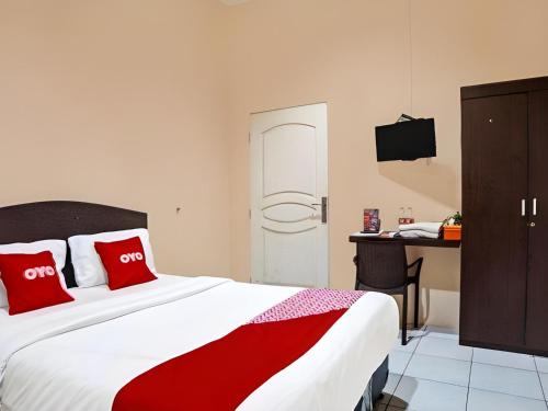 Katil atau katil-katil dalam bilik di Hotel O Medan City Near Lapangan Benteng Formerly Ralica Residence