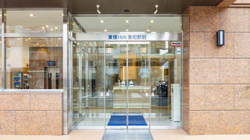 an entrance to a building with a glass door at Toyoko Inn Takamatsu Ekimae in Takamatsu