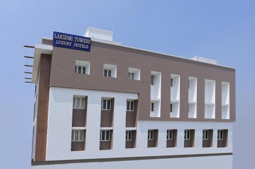 a rendering of the front of a building at Hotel Lakshmi Towers in Kāngayam