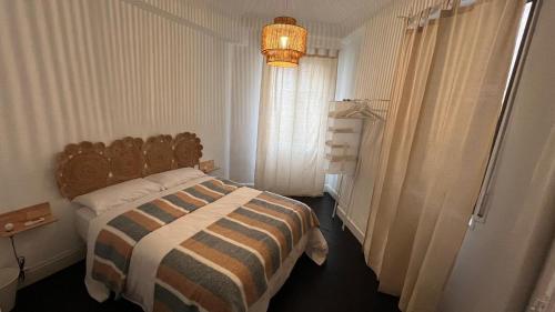 Una cama o camas en una habitación de HT MIRIBILLA habitaciones turísticas con baños compartidos sin ascensor
