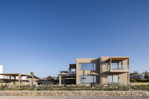 a rendering of a building with an apartment at Villa Aya - Coastal Villa, Minimalist Elegance by etouri in Stavromenos