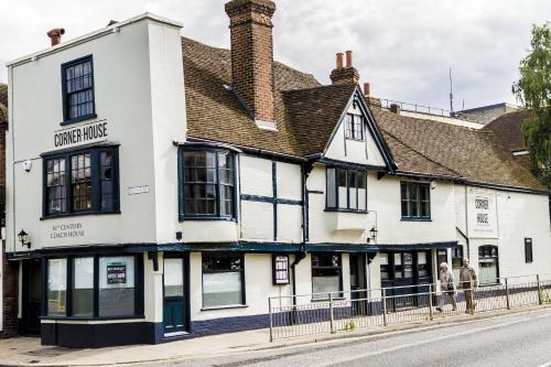 a white building on the corner of a street at Corner House Canterbury in Canterbury