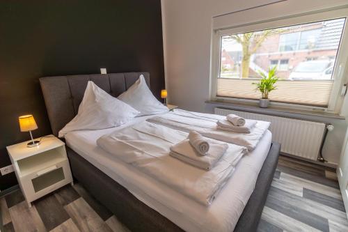 Postel nebo postele na pokoji v ubytování Ferienwohnung Ant Dopke