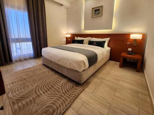 Postel nebo postele na pokoji v ubytování AMR ACACIA Hotel