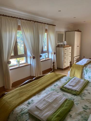 Postel nebo postele na pokoji v ubytování Bayview Guest House