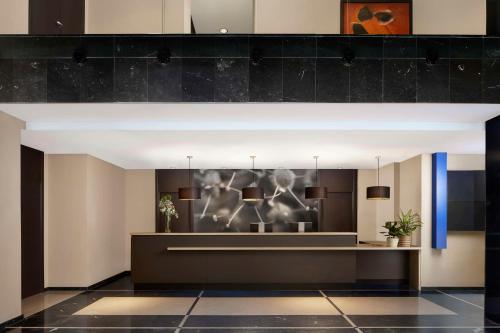 a lobby of a hotel with a reception desk at NH Madrid Ribera del Manzanares in Madrid