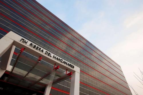 a building with the words mi never be uncertain at NH Madrid Ribera del Manzanares in Madrid