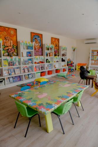 a classroom with a table and chairs in a room at Costabella Tropical Beach Hotel in Mactan