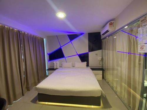 Postel nebo postele na pokoji v ubytování Hotel Vevo Puchong Malaysia