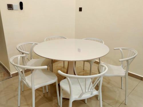 a white table and chairs in a room at Mootopia BM homestay room rent in Bukit Mertajam