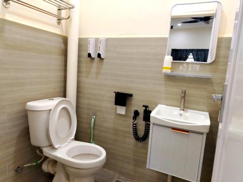 a bathroom with a toilet and a sink at Mootopia BM homestay room rent in Bukit Mertajam