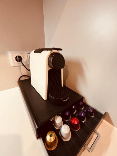 a toaster sitting on top of a black shelf at Modern apartment with balcony and free parking in Porto