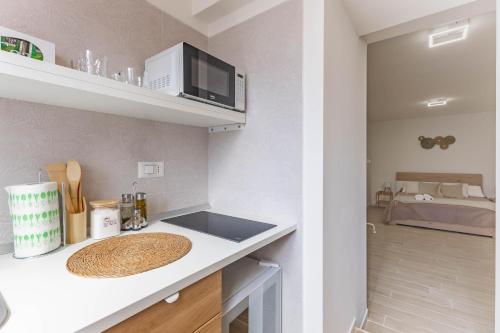a kitchen with a counter top with a sink at 4 Twins - Central Room in Bari