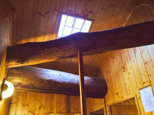 a wooden beam in a room with a window at B&B Levigliani in Levigliani