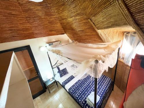 Postel nebo postele na pokoji v ubytování Magnifica Villa en corazón de Saly ! con piscina