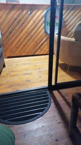a view of a living room with a wooden floor at The Man Cave in Sabie