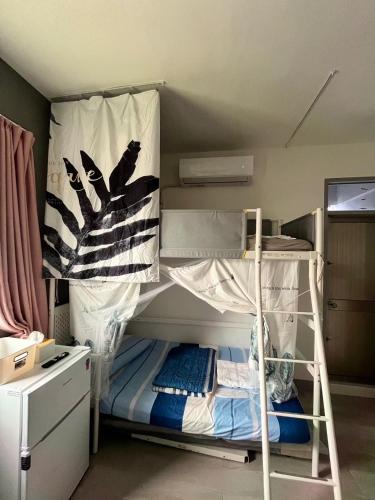 Katil atau katil-katil dalam bilik di PayaThai B&B