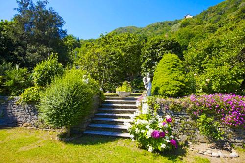 a set of stairs in a garden with flowers at Rustico alla Spiaggia in Carmine